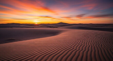 Fototapeta premium Sunrise over a vast, sandy desert landscape