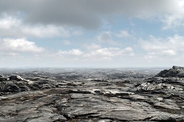 Vast, dark, rocky landscape under a light cloudy sky