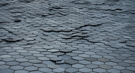 Abstract floor of gray hexagonal tiles, some tilted upwards, perspective view