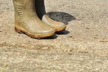 Muddy Boots on Gravel Road