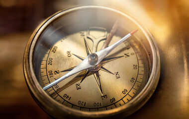 Old compass. Macro shot, shallow focus. Travel, geography, navigation, tourism and exploration concept background.