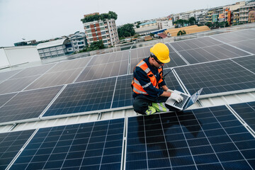 Technician assesses solar panel performance on rooftop in urban setting during overcast day
