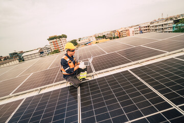 Worker inspects solar panels on rooftop in urban setting during daytime deployment in modern energy...
