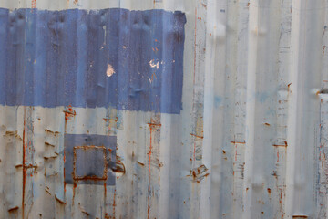 Surface of old zinc has traces of use background.