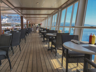 Outdoor whirlpool jacuzzi and private sun deck onboard modern luxury cruiseship cruise ship ocean liner with turquoise water, elegant rattan loungers and deck chairs for guests and wellness
