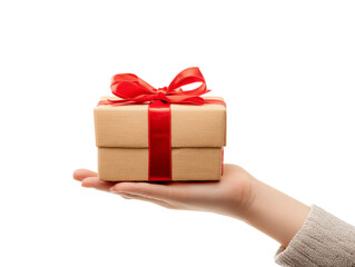 Obraz premium A hand tenderly offers a beautifully wrapped gift box adorned with a vibrant red ribbon