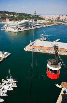 Boats and cable car over urban harbor with vivid colors and docked yachts, no location.