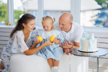 Family enjoys citrus celebration in a bright, modern living room setting