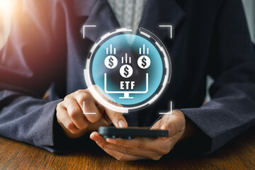 Business professional using a digital device to explore ETF investment opportunities, highlighting financial growth and technology.