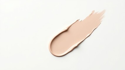 Light beige foundation smudge on white background.