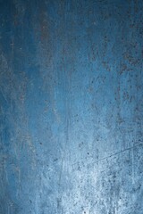 Fototapeta premium Blue grunge texture background with scratches and worn paint, perfect for adding a vintage or retro feel to graphic designs and illustrations