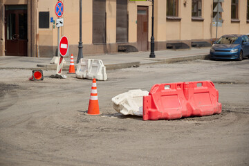 Urban Roadwork Area featuring Traffic Barriers alongside Detour Signs for safety and guidance