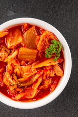 Kimchi pickled cabbage salad spicy savory vegetables fresh delicious gourmet food background on the table rustic food top view copy space vegetarian and vegan food