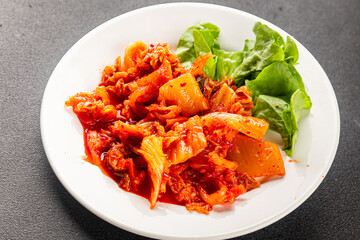 Kimchi pickled cabbage salad spicy savory vegetables fresh delicious gourmet food background on the table rustic food top view copy space vegetarian and vegan food