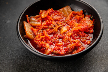 Kimchi pickled cabbage salad spicy savory vegetables fresh delicious gourmet food background on the table rustic food top view copy space vegetarian and vegan food