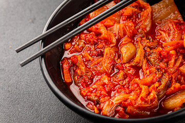 Kimchi pickled cabbage salad spicy savory vegetables fresh delicious gourmet food background on the table rustic food top view copy space vegetarian and vegan food