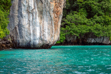 Natural surroundings of Ko Phi Phi Lee Island in Krabi Province, Thailand, with emerald waters and stunning rocks