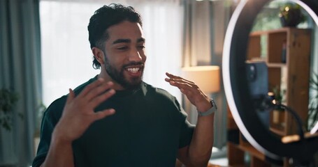 Home, influencer and man with smartphone, ring light and excitement with social media. Apartment, content creation and person with equipment, cellphone and live streaming with digital app and energy - Powered by Adobe