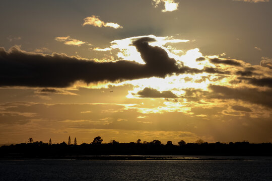 Bright white clouds drifting across deep blue sky