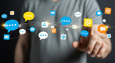 social media chat, Man pointing at floating colorful speech bubbles and icons for messaging email network and comments in virtual communication interface representing online interaction

