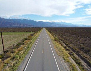 Empty road stretching through a landscape