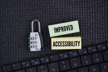Keyboards, keys and colored paper with the words Improved accessibility. making something easier to...