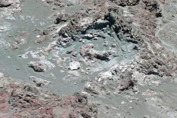 Close-up view of diverse rock formations, muted colors, and textures