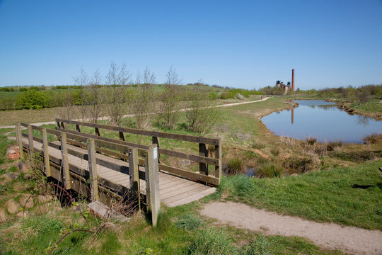 Pleasley Colliery reflecting in pond, Derbyshire, England