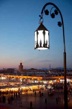 View over market square at dusk, Place Jemaa El Fna, Marrakesh, Morocco, North Africa