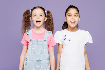 Little shocked surprised overjoyed two friends kids children girls 9-10 years old wearing casual...