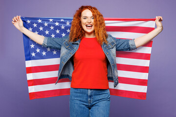 Young smiling happy cheerful ginger woman she wears red t-shirt denim shirt hold in hands big huge...