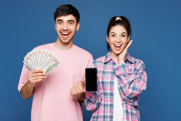 Young couple two friends family man woman they wear pink casual clothes together hold fan of cash...