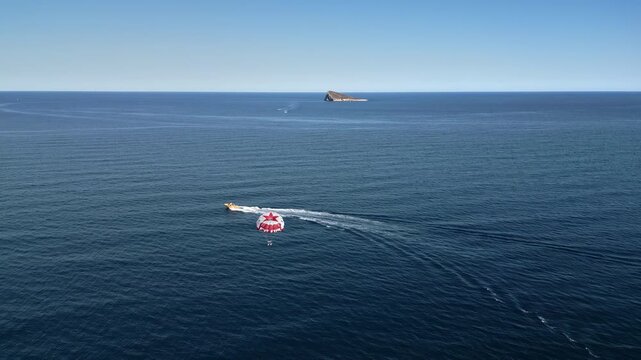 People parasailing on the Mediterranean Sea in Benidorm, Spain