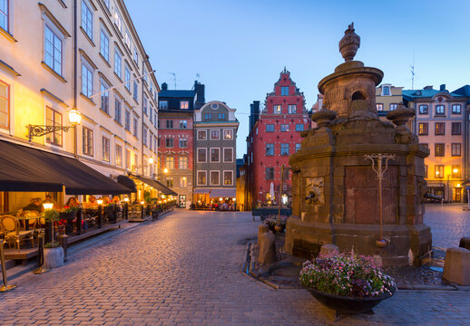 Restaurant and colourful buildings on Stortorget, Old Town Square in Gamla Stan at dusk, Stockholm, Sweden, Scandinavia