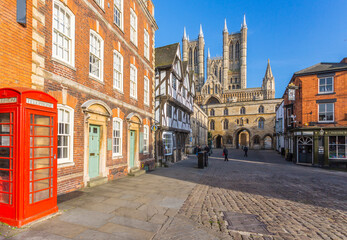 Lincoln Cathedral viewed from Exchequer Gate with red telephone visible, Lincoln, Lincolnshire, England