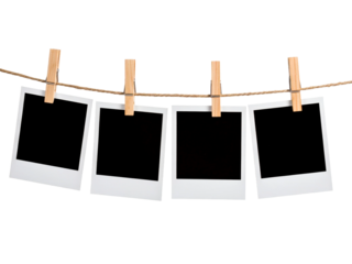 Blank polaroid frames hung up by wooden clothespins, suitable for showcasing memories, creating a photo collage, or adding text overlays.