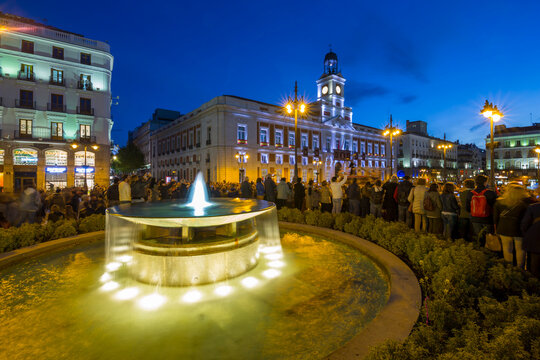 View of King Carlos lll statue and Easter Parade, Puerta del Sol at dusk, Madrid, Spain