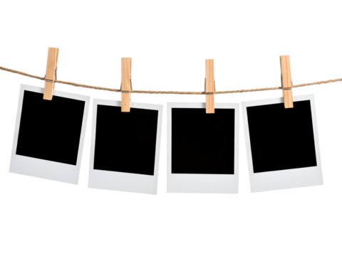 Blank polaroid frames hung up by wooden clothespins, suitable for showcasing memories, creating a photo collage, or adding text overlays.