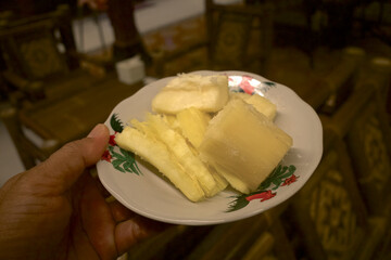 Boiled Cassava, Mandioa, Manioc, Tapioca (Manihot esculenta), on a white ceramic plate