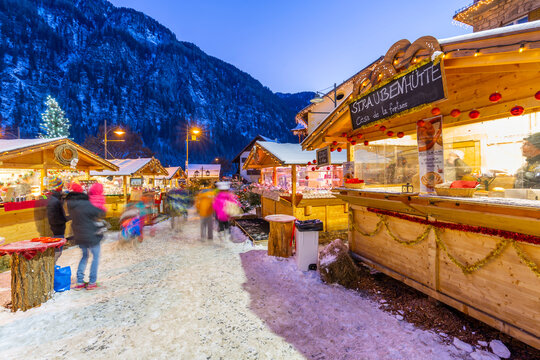 Christmas market at sunset in Campitello di Fassa, Val di Fassa, Trentino, Italy