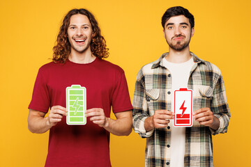 Young happy sad two friends buddies men wear casual clothes together hold in hand card symbols with...