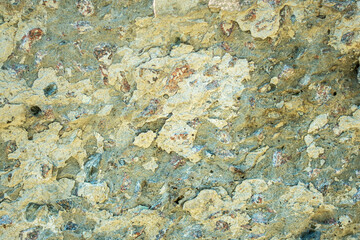 Peeling plaster and paint from the base of the wall as an abstract background.