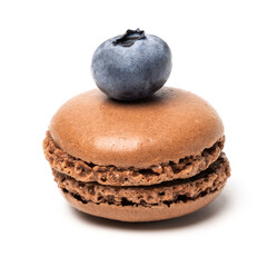 Small tasty sweet original classic macaroon cake with fresh blueberry on top isolated on white...