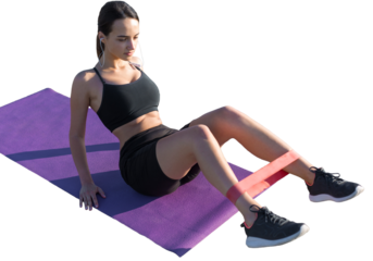 Young attractive woman doing exercise working out outdoors.