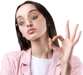 Portrait of beautiful young woman in pink jacket thinking isolated on red background. Shows an OK...