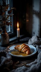 Moody apple swirl croissant with maple glaze and candlelight