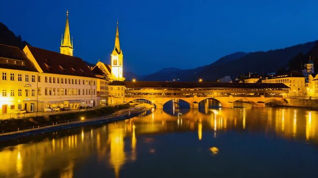 Historic old bridge and heiliggeistkirche church reflecting on the calm waters of the drava river at twilight, creating a serene scene in bruck an der mur, austria
