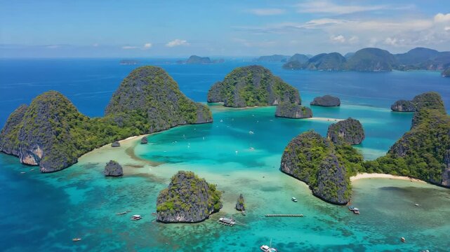Aerial view of mu ko ang thong national marine park showing the typical turquoise water and limestone islands, with some boats sailing and some moored near the shore