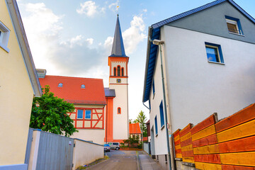 Charming Streetscape in Rossdorf Featuring Historic Church and Modern Homes