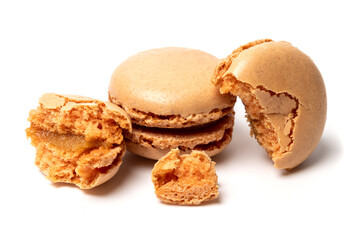 Broken into pieces tasty sweet original classic macaroon cake isolated on white studio background